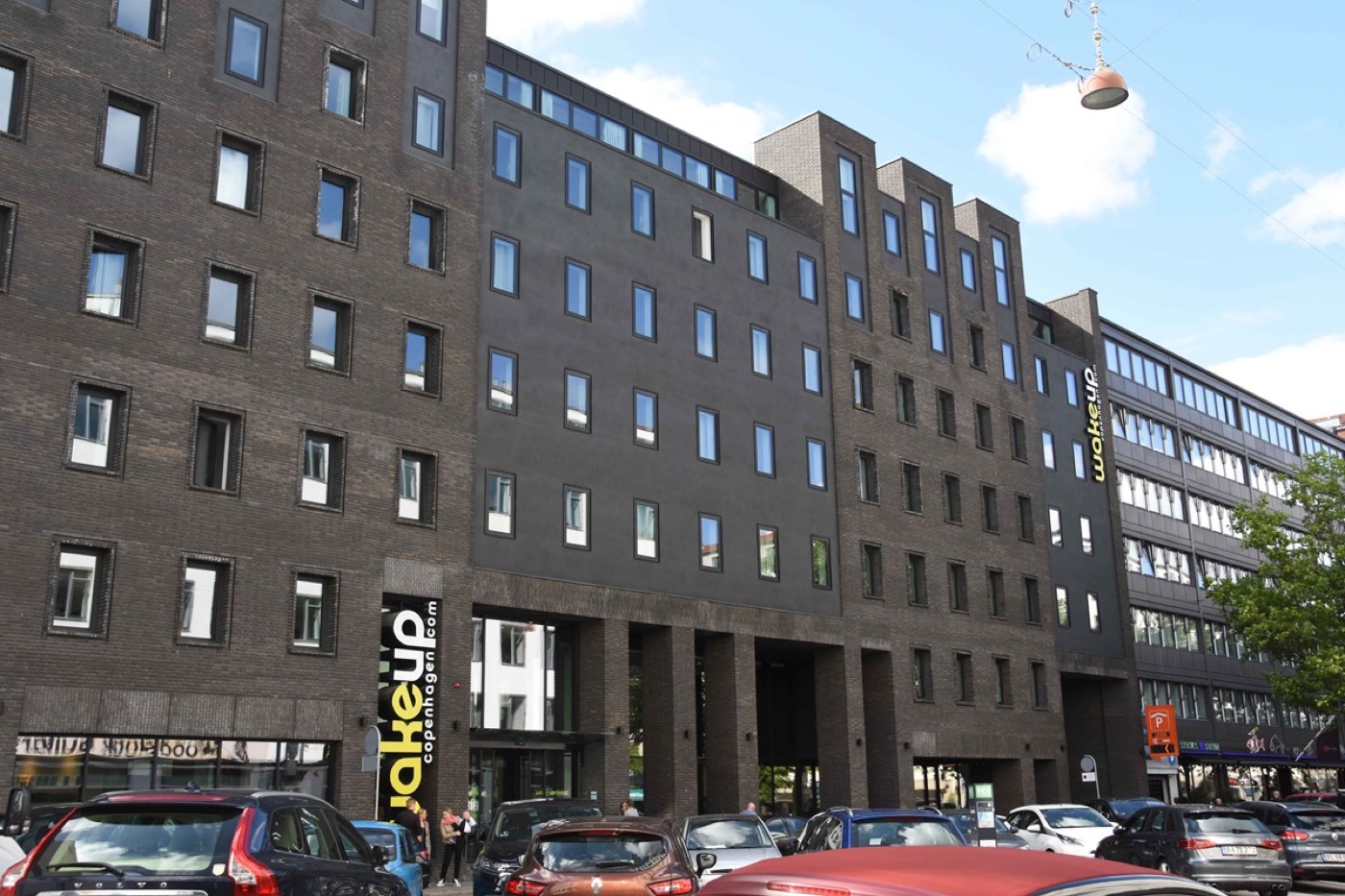 The dark brick facade of Wakeup Copenhagen on Borgergade