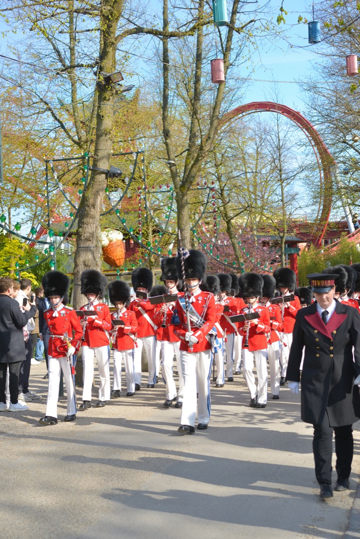 The Tivoli Boys Guard marching through the gardens in red uniforms